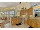 Spacious eat-in kitchen overlooking lake, boasting granite counters and stainless appliances at 410 Wellington, Venice, FL 34292