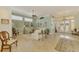 Spacious living room leading to the entrance, showcasing a seamless blend of comfort and design at 410 Wellington, Venice, FL 34292
