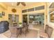 Outdoor patio with dining set and grill, offering a seamless transition to the living space at 410 Wellington, Venice, FL 34292
