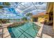 Beautiful backyard pool with a spa, screened-in enclosure, and a view of the waterfront at 410 Wellington, Venice, FL 34292
