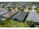 Aerial view showing houses with green lawns and rooftops within a community at 4318 Deep Creek Ter, Parrish, FL 34219