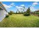 Expansive backyard showcasing a well-maintained lawn and mature trees providing ample shade at 4318 Deep Creek Ter, Parrish, FL 34219