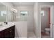 Contemporary bathroom with a glass-enclosed shower and a dark wood vanity at 4318 Deep Creek Ter, Parrish, FL 34219