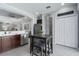 Open kitchen area featuring an island table with seating, stainless steel appliances and storage at 4318 Deep Creek Ter, Parrish, FL 34219