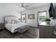 Bright main bedroom with neutral tones, natural light, a ceiling fan, and a plush upholstered bed at 4318 Deep Creek Ter, Parrish, FL 34219