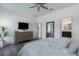 Comfortable main bedroom with dresser, TV, and a view into the main bathroom at 4318 Deep Creek Ter, Parrish, FL 34219