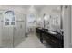 Bright bathroom features a large glass shower, double sinks, and decorative mirrors at 4355 Pompano Ln, Palmetto, FL 34221