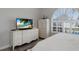 Bright bedroom featuring white decor, luxury vinyl plank flooring and modern TV console at 4355 Pompano Ln, Palmetto, FL 34221