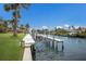 Modern boat dock with well-maintained lift system, surrounded by lush landscaping at 4355 Pompano Ln, Palmetto, FL 34221