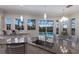 Beautiful kitchen with stainless steel appliances, granite countertops, a large island, and a view of the pool at 4355 Pompano Ln, Palmetto, FL 34221