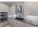 Modern kitchen features stainless appliances, granite countertops, designer backsplash, and custom cabinetry at 4355 Pompano Ln, Palmetto, FL 34221