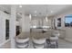 Gourmet kitchen with a large island, bar seating, stainless steel appliances, and access to laundry room at 4355 Pompano Ln, Palmetto, FL 34221