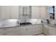 A chef-inspired kitchen with stainless steel appliances, custom cabinetry, granite countertops, and modern range hood at 4355 Pompano Ln, Palmetto, FL 34221