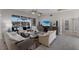 Spacious living area with open-concept design, pool views, and comfortable seating at 4355 Pompano Ln, Palmetto, FL 34221