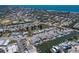 Aerial view of neighborhood featuring waterfront homes with boat docks and canal access at 444 63Rd St, Holmes Beach, FL 34217