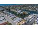 Aerial view of a waterfront home in a residential neighborhood with canals and docks at 444 63Rd St, Holmes Beach, FL 34217