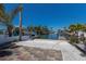 Backyard patio with brick flooring and a view of the waterfront canal and boat docks at 444 63Rd St, Holmes Beach, FL 34217