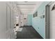 Entrance way with geometric cinderblock accent wall and aqua wall at 444 63Rd St, Holmes Beach, FL 34217