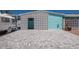 Charming home with a geometric cinderblock accent wall and a paved drive at 444 63Rd St, Holmes Beach, FL 34217
