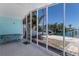 Covered outdoor patio with brick flooring leading to a canal view at 444 63Rd St, Holmes Beach, FL 34217
