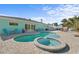 Backyard featuring a pool, spa, and an outdoor dining area on a brick patio at 4440 Yacht Club Dr, Venice, FL 34293