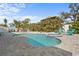 Landscaped backyard with pool, spa, patio and dining area at 4440 Yacht Club Dr, Venice, FL 34293