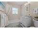 Bright bathroom with a marble vanity top, white drawers and updated fixtures at 4440 Yacht Club Dr, Venice, FL 34293