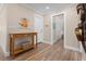 Hallway with closet and adjacent small table and basket on the floor at 4440 Yacht Club Dr, Venice, FL 34293