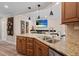 Granite countertop with double sink, stainless appliances and tile backsplash give a fresh feel to this kitchen at 4440 Yacht Club Dr, Venice, FL 34293