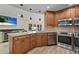 The beautifully updated kitchen features stainless appliances, wood cabinets and granite counters at 4440 Yacht Club Dr, Venice, FL 34293