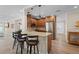 Kitchen with a breakfast bar, granite counters, stainless appliances and hardwood flooring at 4440 Yacht Club Dr, Venice, FL 34293