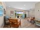 Inviting living room featuring hardwood floors, ample natural light, and eclectic decor at 4440 Yacht Club Dr, Venice, FL 34293