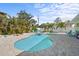 Backyard pool with spa, paved deck and surrounding landscaping at 4440 Yacht Club Dr, Venice, FL 34293