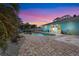 Stunning backyard oasis with a private pool, brick patio, spa, and lush tropical landscaping at 4440 Yacht Club Dr, Venice, FL 34293
