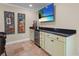 The wet bar has a wine chiller, granite countertop and seating at 4440 Yacht Club Dr, Venice, FL 34293