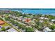 Aerial view of the property highlighting its location, landscaping, and surrounding community near the water at 519 Bayview Ave, Osprey, FL 34229