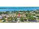 Expansive aerial view of a waterfront community with lush landscaping and tropical surroundings at 519 Bayview Ave, Osprey, FL 34229