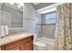 Neutral bathroom features a vanity and tiled shower/tub combination at 519 Bayview Ave, Osprey, FL 34229