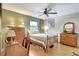 Comfortable bedroom with a ceiling fan, hardwood floors, and ample natural light at 519 Bayview Ave, Osprey, FL 34229