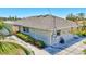 Side exterior of house and detached garage, with landscaping, and concrete driveway at 519 Bayview Ave, Osprey, FL 34229
