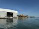 View of the hangar and boat house with waterfront access at 519 Bayview Ave, Osprey, FL 34229