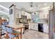 Bright kitchen featuring modern appliances, breakfast bar, and stylish backsplash at 519 Bayview Ave, Osprey, FL 34229