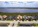 An aerial view shows an upscale neighborhood situated on the water with beautiful landscaping at 5502 Tidewater Preserve Blvd, Bradenton, FL 34208