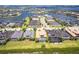 Aerial view of a waterfront community with lush landscaping and stunning water views at 5502 Tidewater Preserve Blvd, Bradenton, FL 34208