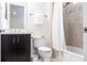 Clean and bright bathroom with a vanity, toilet, and shower-tub combination with neutral tile at 5502 Tidewater Preserve Blvd, Bradenton, FL 34208