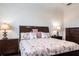 Spacious bedroom showcasing a well-appointed bed with decorative pillows and matching nightstands at 5502 Tidewater Preserve Blvd, Bradenton, FL 34208