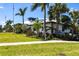 Beautiful clubhouse with lush landscaping offers a welcoming entrance and curb appeal at 5502 Tidewater Preserve Blvd, Bradenton, FL 34208