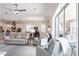 Bright living room with sliding glass doors that open to the lanai, and adjacent to the dining and kitchen areas at 5502 Tidewater Preserve Blvd, Bradenton, FL 34208