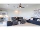 Spacious living room with comfortable seating, bar area, and decorative touches at 5502 Tidewater Preserve Blvd, Bradenton, FL 34208