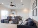 Spacious living room with comfortable seating, bar area, and decorative touches at 5502 Tidewater Preserve Blvd, Bradenton, FL 34208